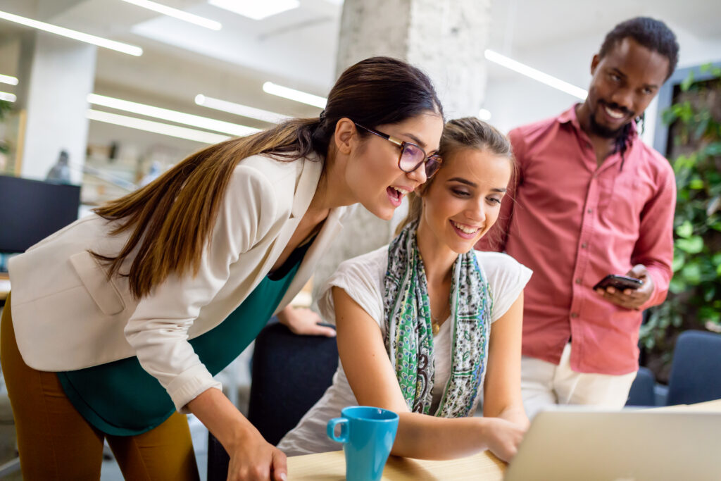 Two seasoned professionals helping a sales intern.